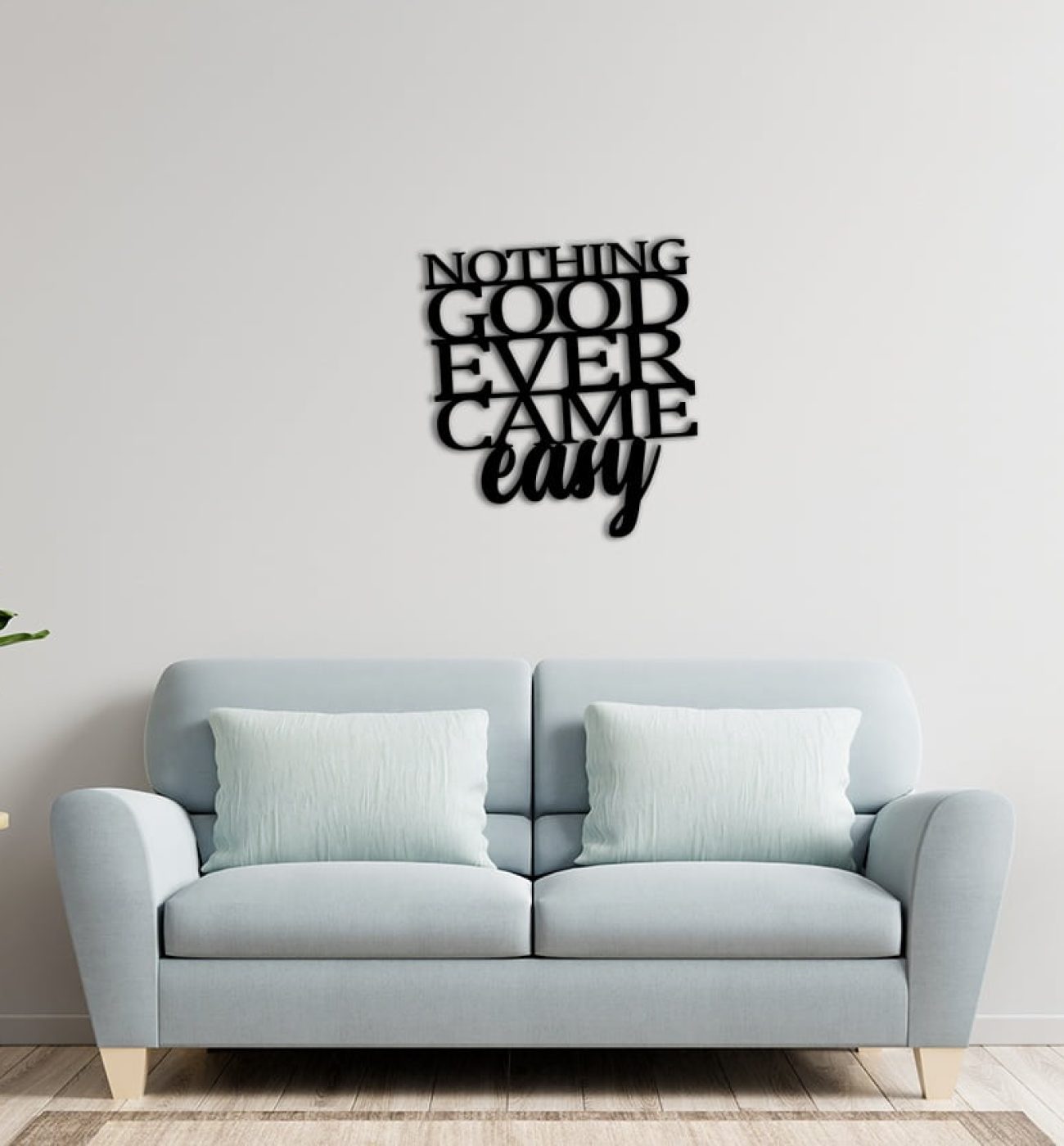 White wall living room have sofa and decoration. Sieninė dekoracija "NOTHING GOOD EVER CAME EASY"